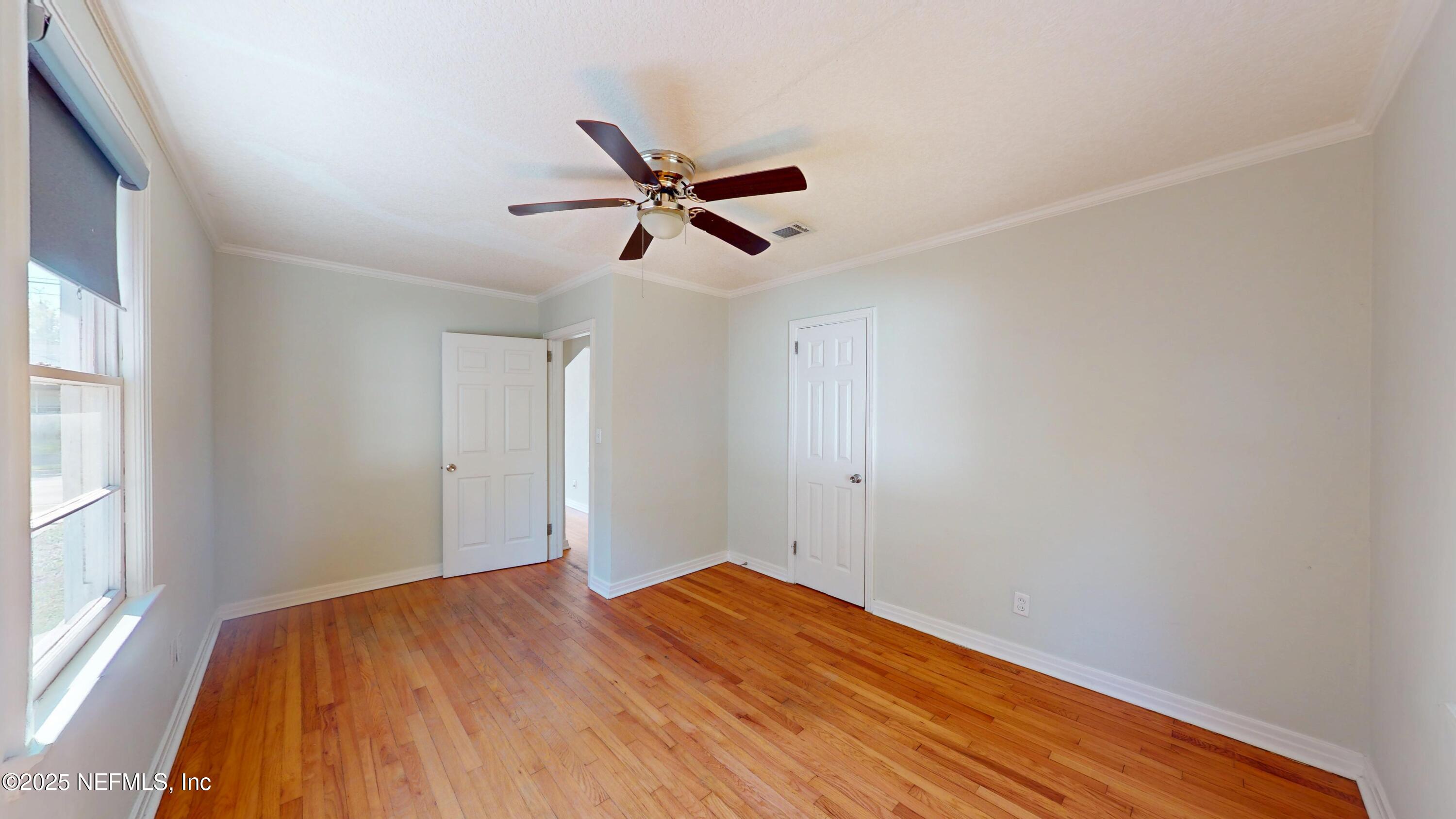 4547 Post Street Jacksonville, FL 32205 - Photo 20 of 23 a view of empty room with wooden floor and fan