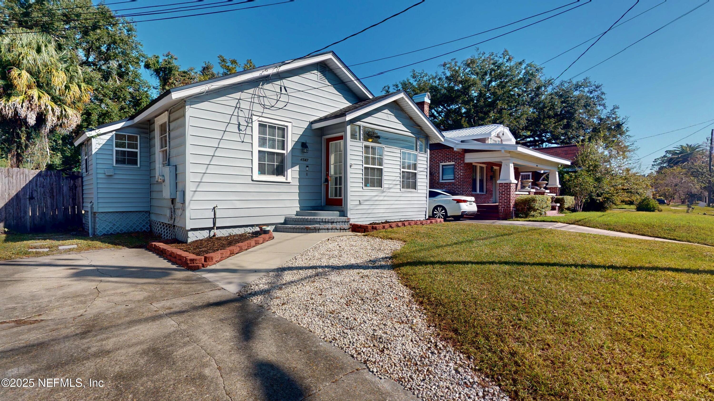 4547 Post Street Jacksonville, FL 32205 - Photo 2 of 23 a front view of a house with a yard