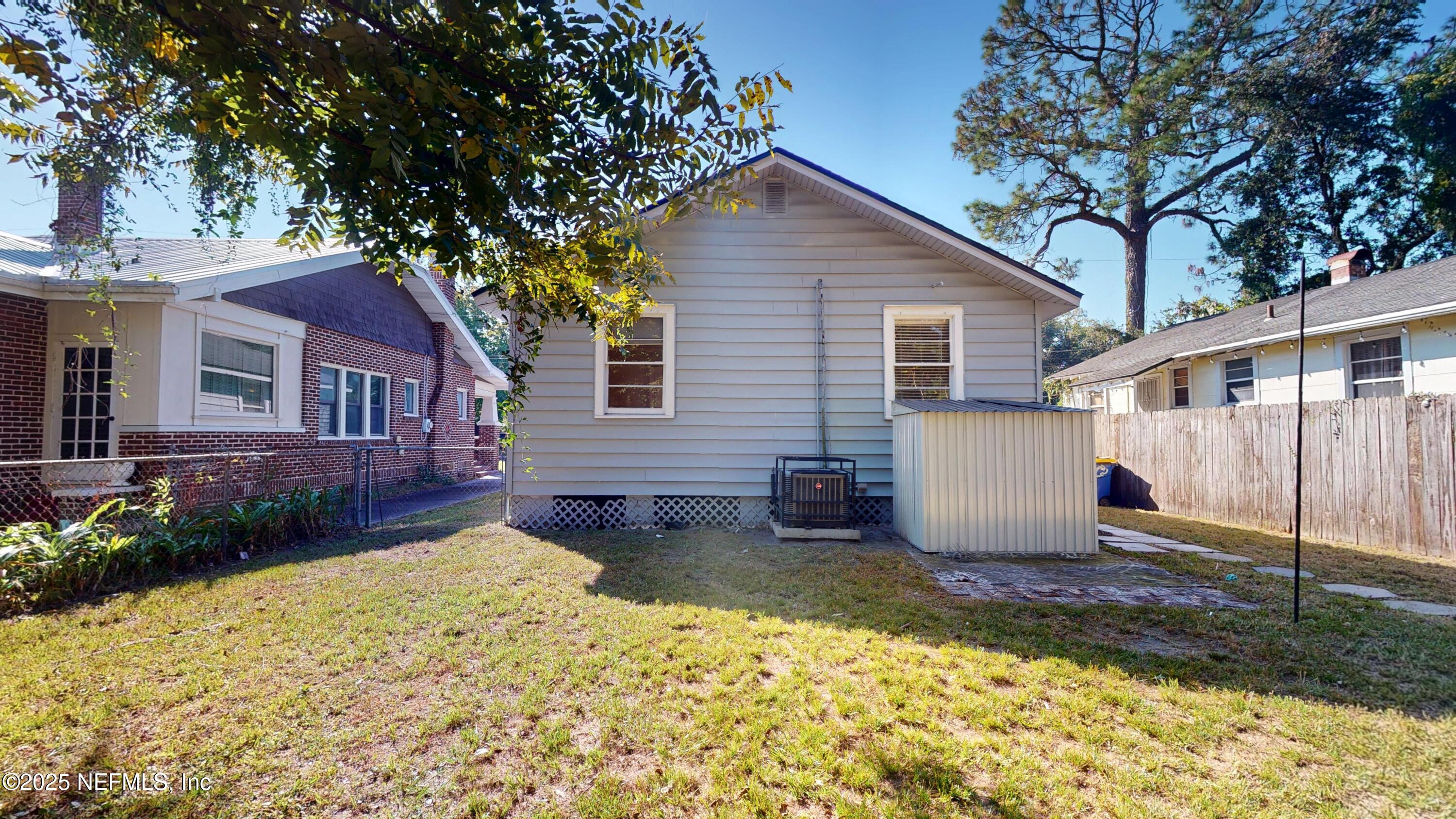 4547 Post Street Jacksonville, FL 32205 - Photo 21 of 23 a front view of a house with a yard and garage