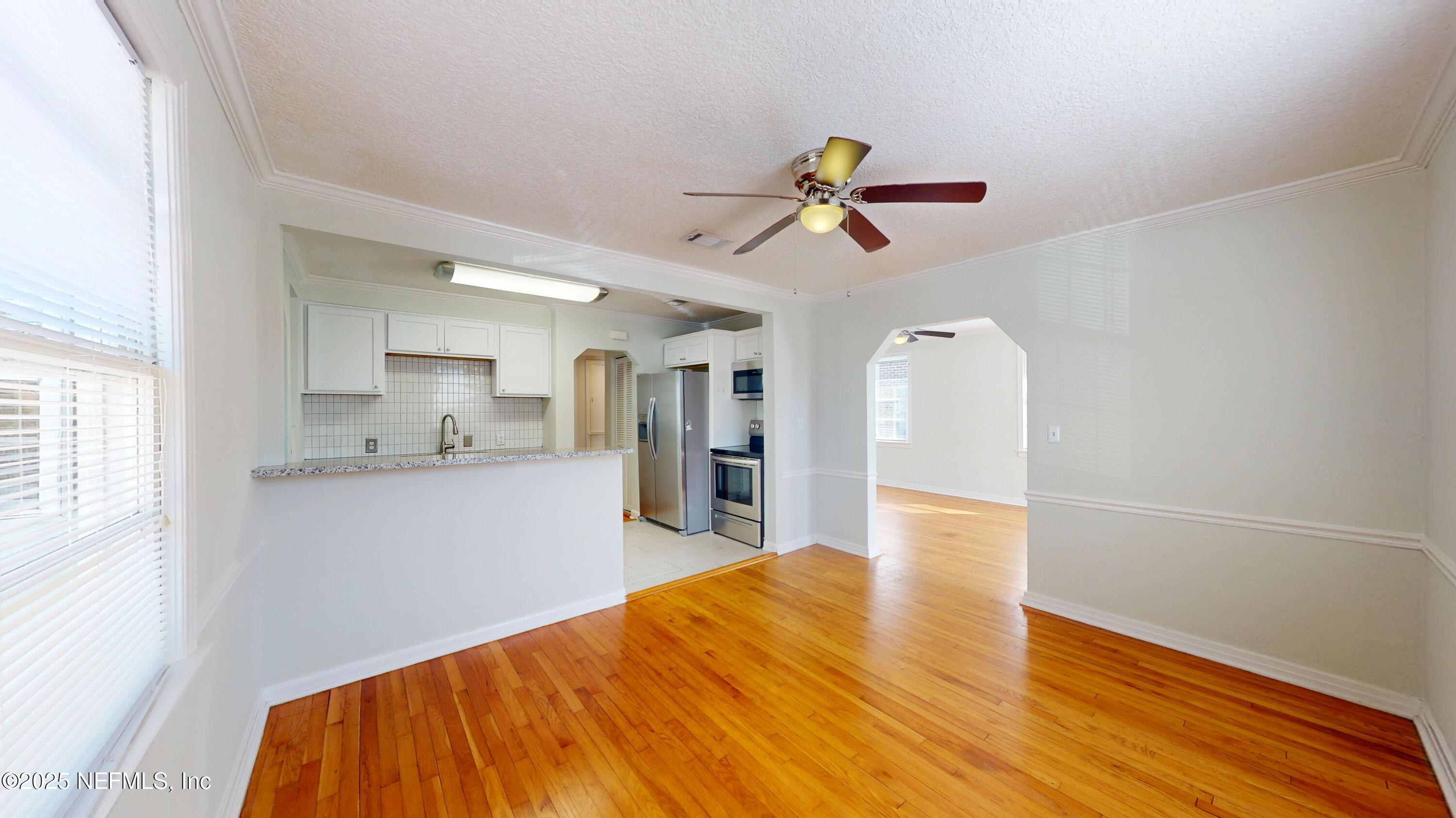 4547 Post Street Jacksonville, FL 32205 - Photo 9 of 23 a view of a kitchen with a sink and wooden floor