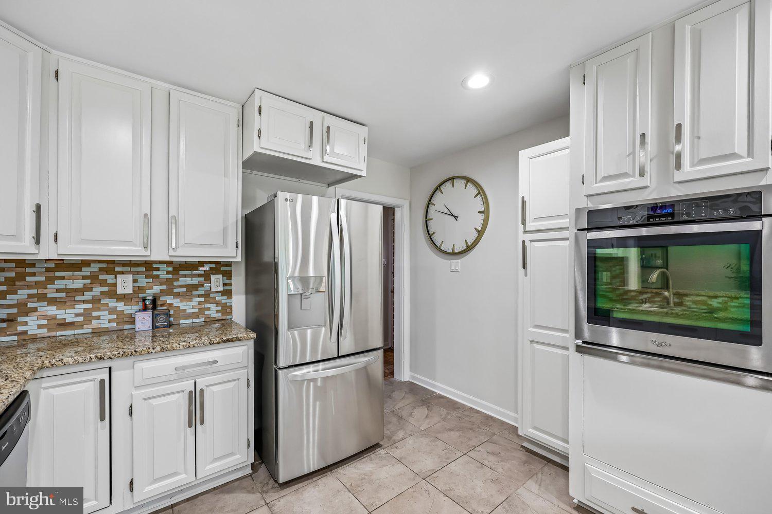 300 Gilsan Court Silver Spring, MD 20902 - Photo 47 of 117 a kitchen with stainless steel appliances granite countertop a refrigerator sink and cabinets