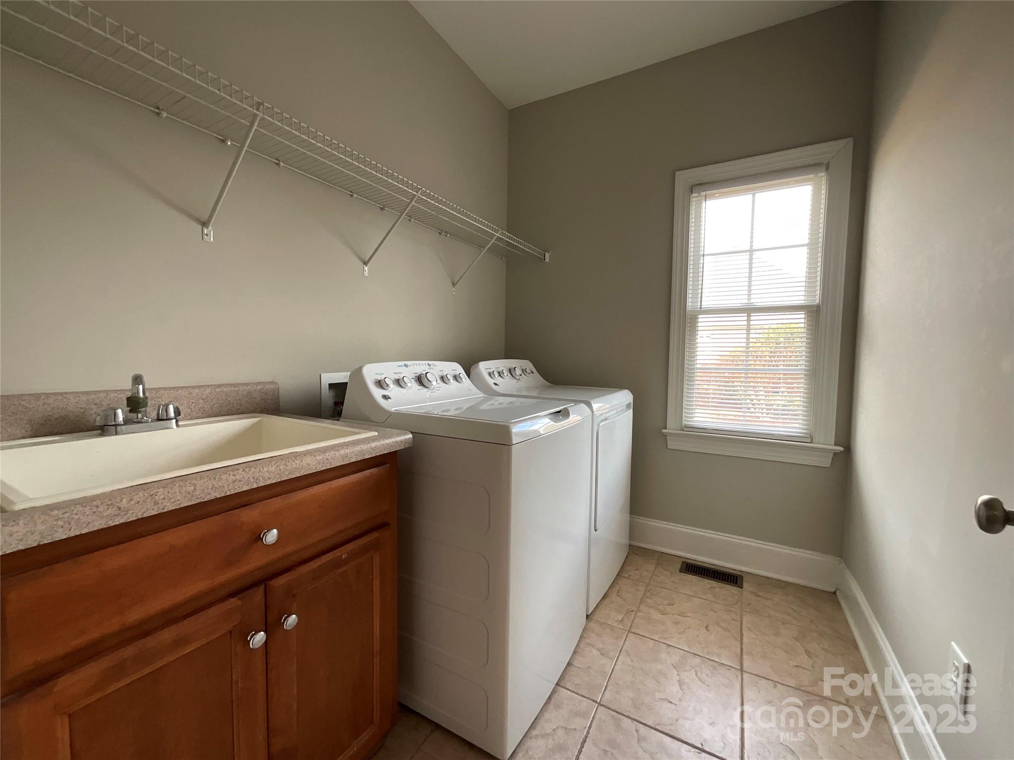 3100 Sea Island Lane Harrisburg, NC 28075 - Photo 15 of 30 a utility room with dryer and washer