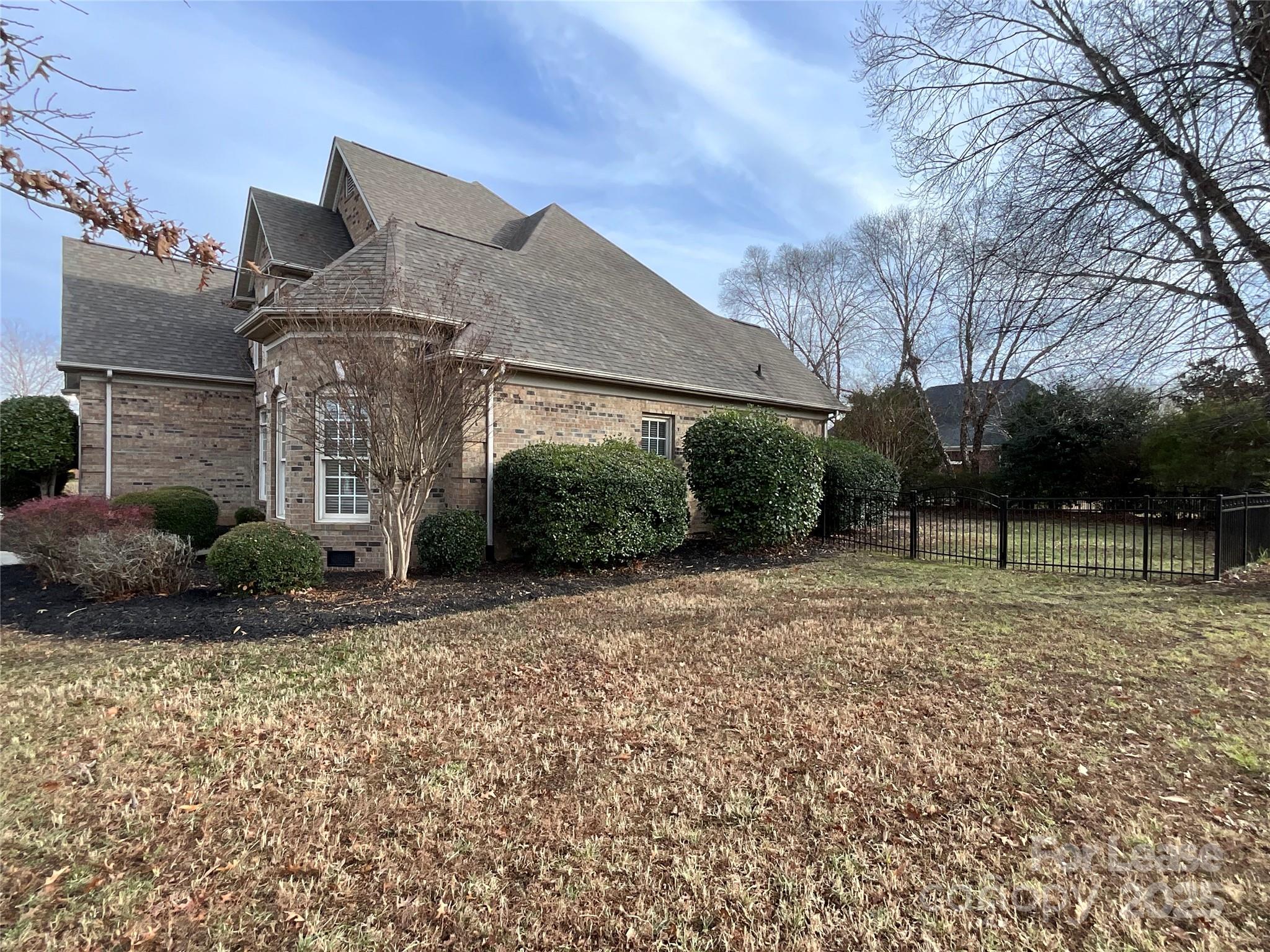 3100 Sea Island Lane Harrisburg, NC 28075 - Photo 28 of 30 a front view of a house with a yard