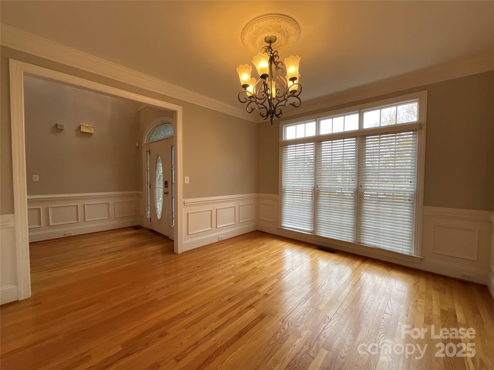 3100 Sea Island Lane Harrisburg, NC 28075 - Photo 4 of 30 a view of a livingroom with wooden floor and a large window