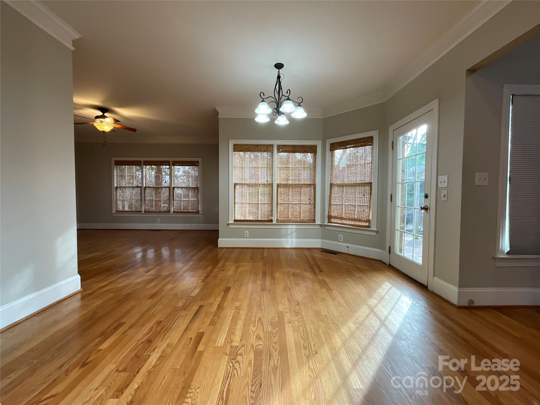 3100 Sea Island Lane Harrisburg, NC 28075 - Photo 8 of 30 wooden floor in an empty room with a window