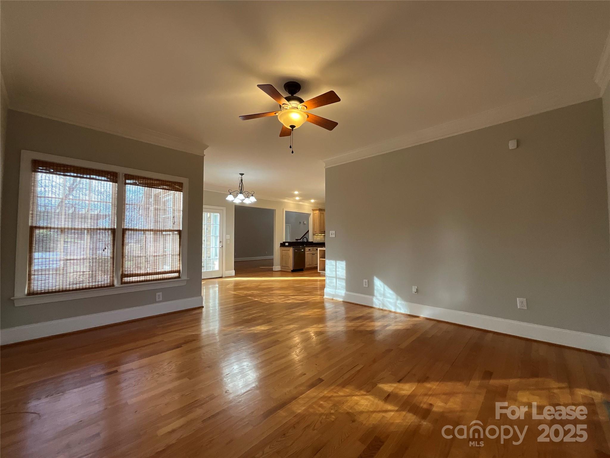 3100 Sea Island Lane Harrisburg, NC 28075 - Photo 10 of 30 a view of an empty room with window and wooden floor