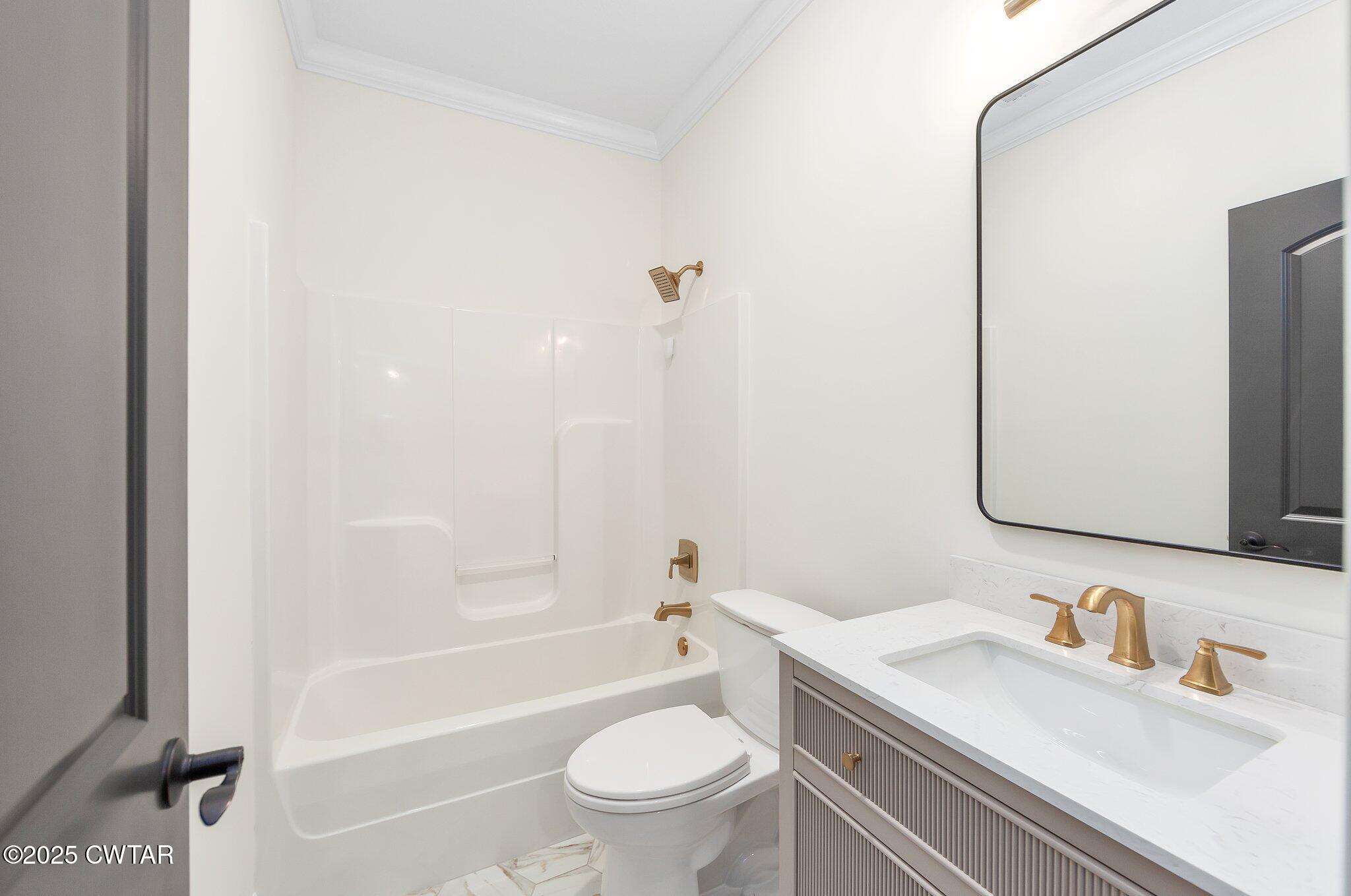 24 Joseph Cove Jackson, TN 38305 - Photo 28 of 37 a bathroom with a bathtub shower sink vanity mirror and toilet