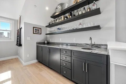 a kitchen with a sink and cabinets