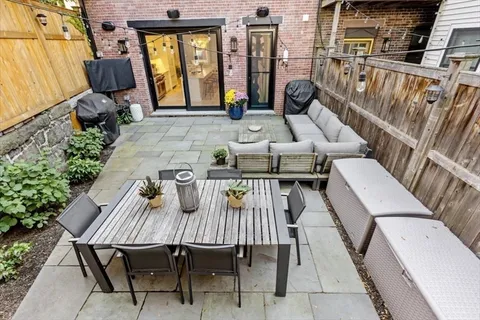 a view of a dinning tables and chairs in patio