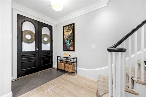 a bedroom with a bed and a dresser next to it