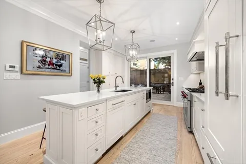 a spacious bathroom with a double vanity sink a mirror and a shower