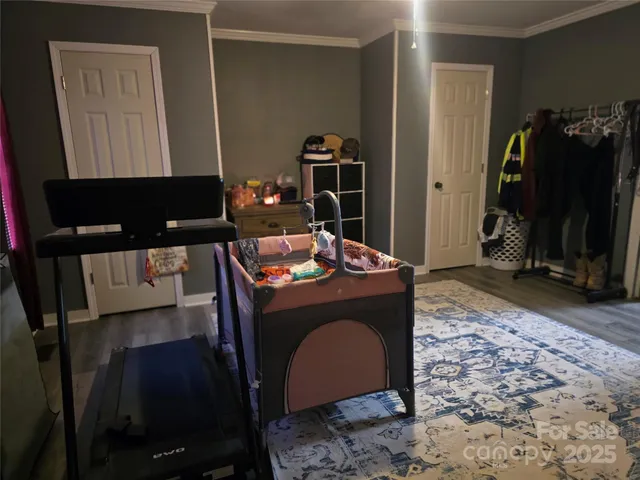 a backyard of a house with a table and chairs