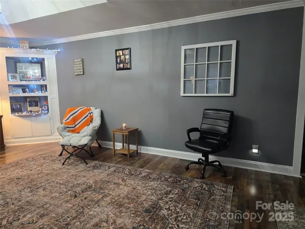 a workspace with furniture and rug
