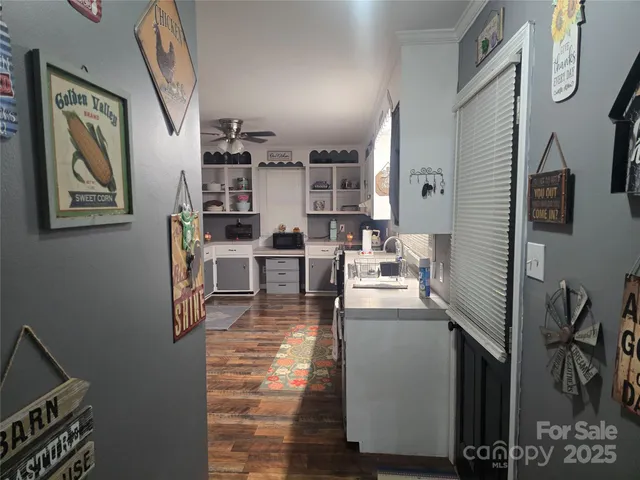 a kitchen with stainless steel appliances granite countertop a refrigerator and a stove