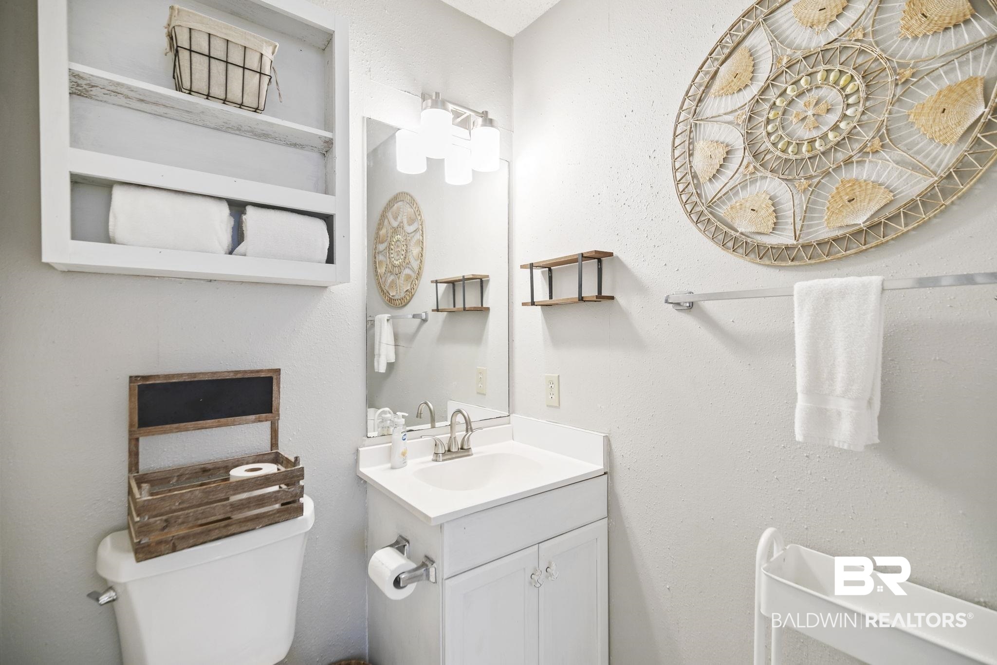 25957 Canal Road, Unit 302 Orange Beach, AL 36561 - Photo 13 of 26 Bathroom featuring toilet and vanity