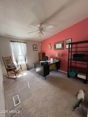 a bedroom with furniture and windows