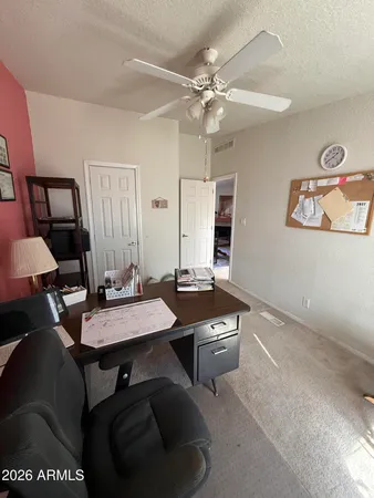 a view of a workspace with furniture