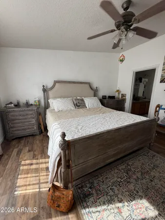 a bed sitting in a bedroom next to a window