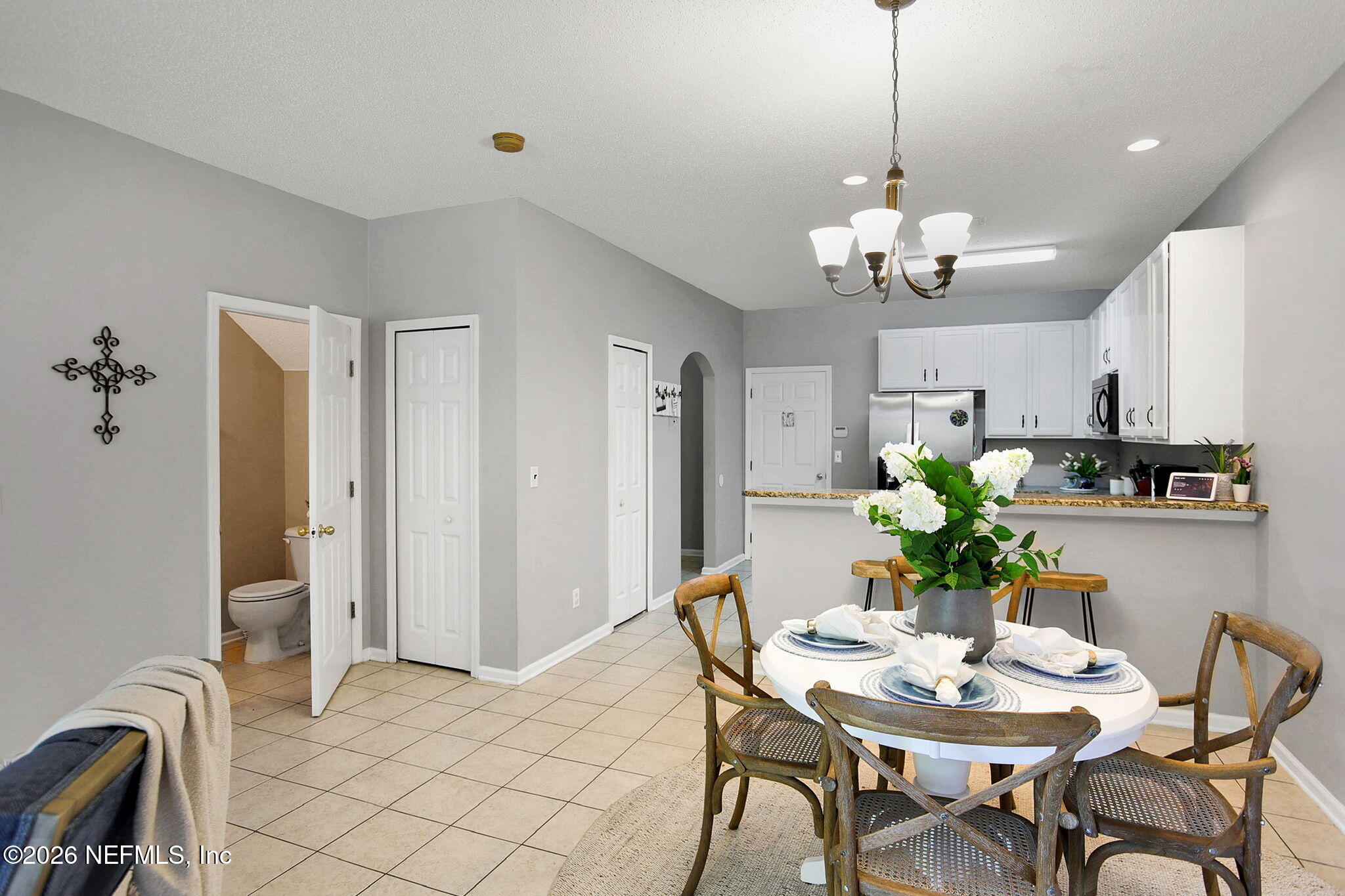 8629 Ribbon Falls Lane Jacksonville, FL 32244 - Photo 11 of 39 a view of a dining room with furniture