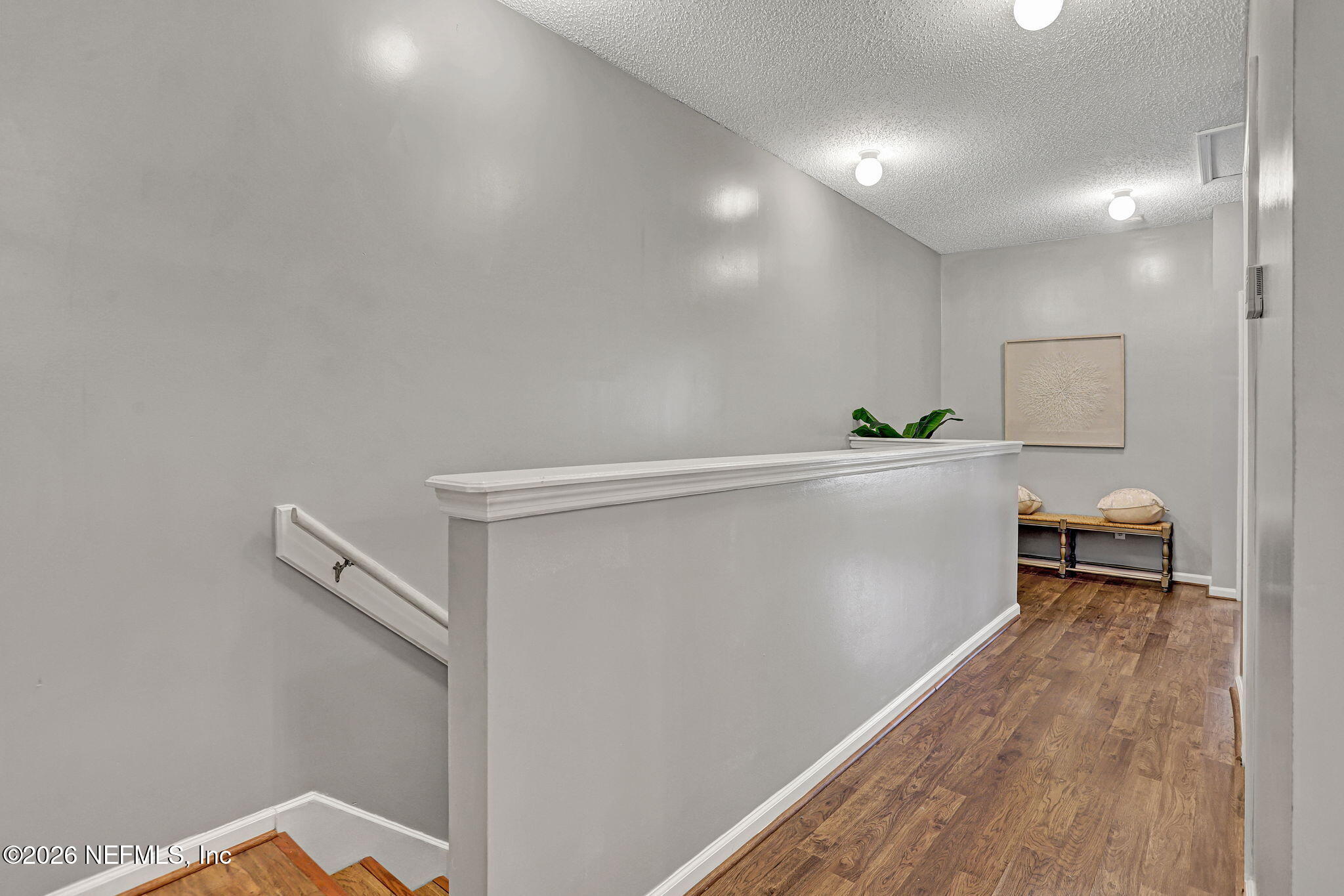 8629 Ribbon Falls Lane Jacksonville, FL 32244 - Photo 17 of 39 a view of a room with wooden floor