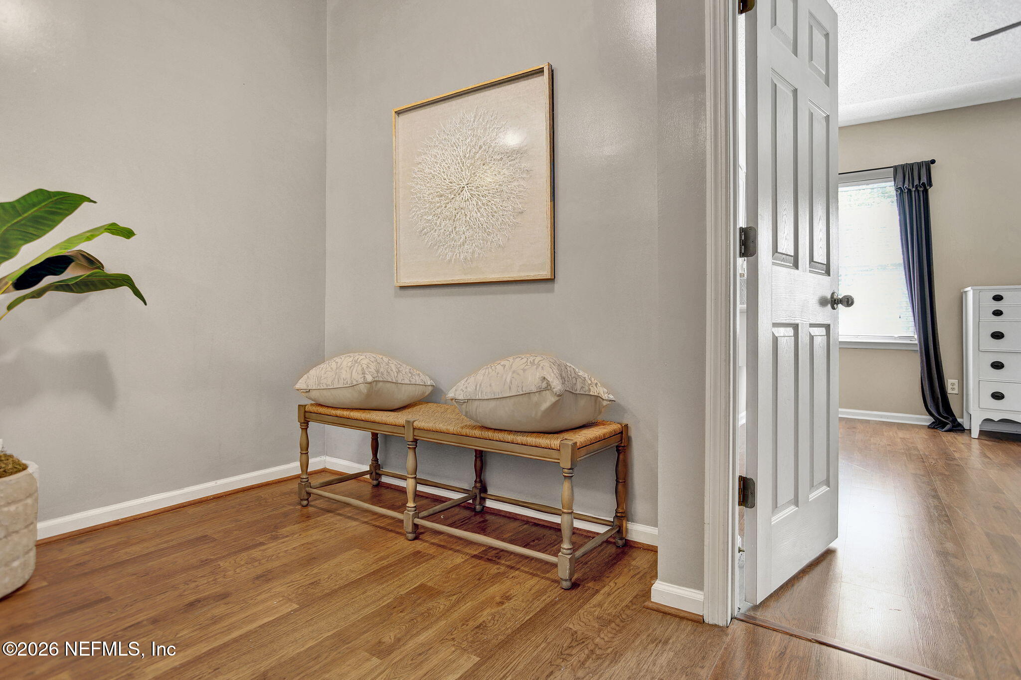 8629 Ribbon Falls Lane Jacksonville, FL 32244 - Photo 18 of 39 a view of a workspace with furniture and wooden floor