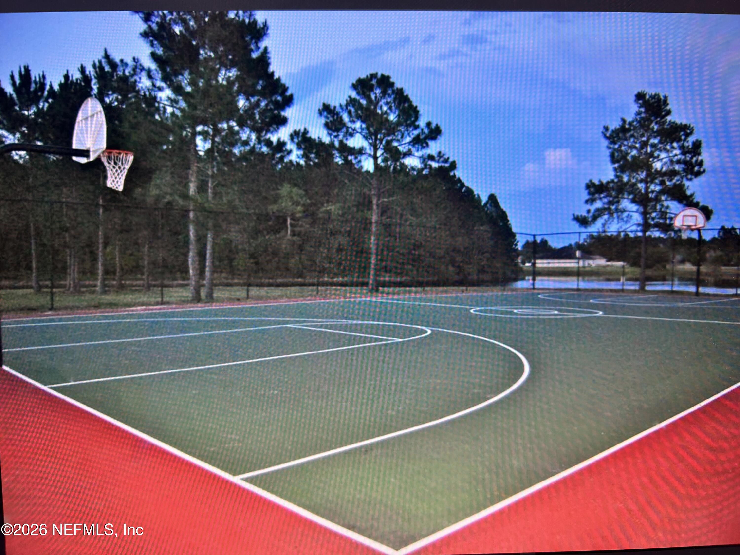 8629 Ribbon Falls Lane Jacksonville, FL 32244 - Photo 28 of 39 a view of a tennis court