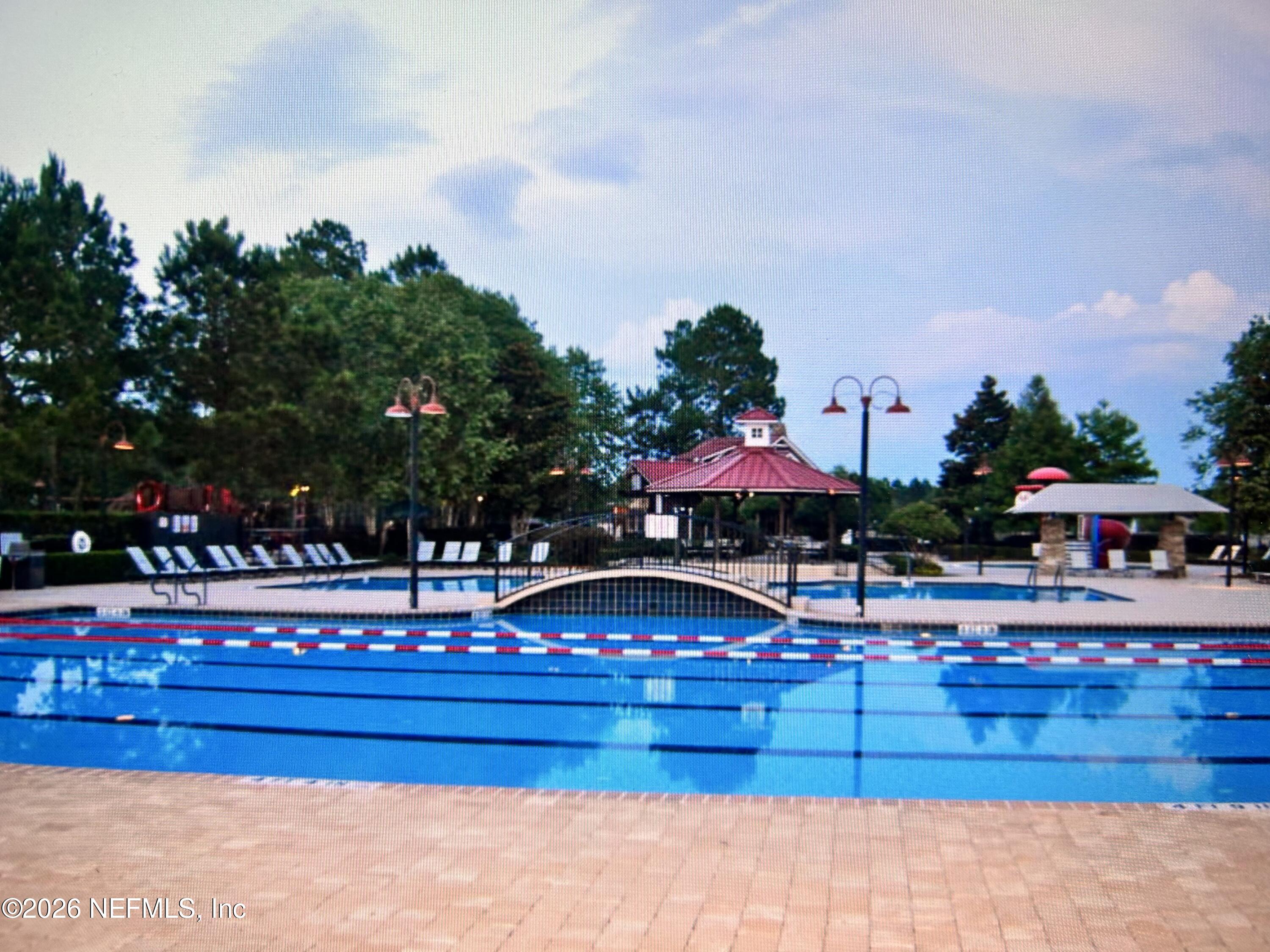 8629 Ribbon Falls Lane Jacksonville, FL 32244 - Photo 34 of 39 a view of swimming pool with outdoor seating