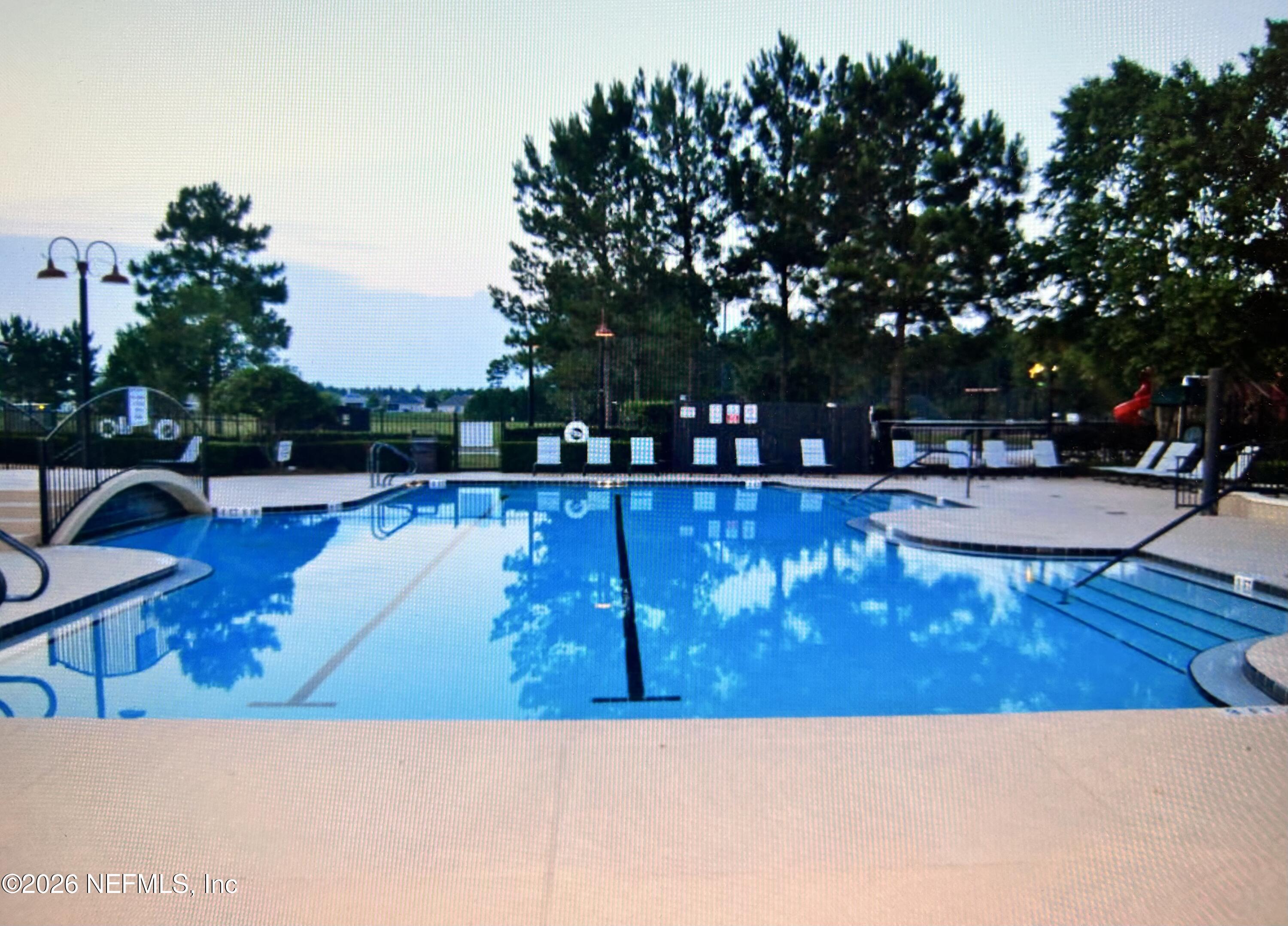 8629 Ribbon Falls Lane Jacksonville, FL 32244 - Photo 35 of 39 a view of a swimming pool with an outdoor space