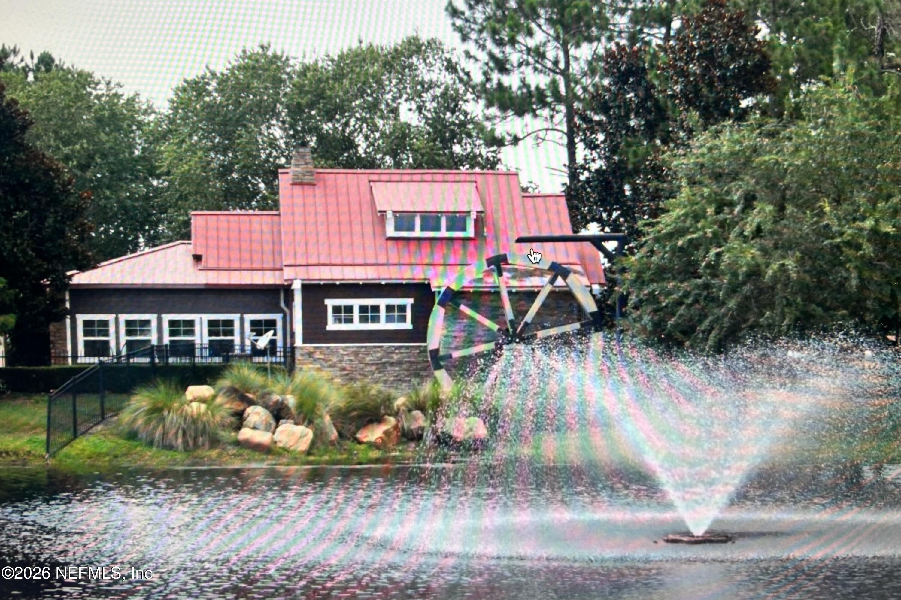 8629 Ribbon Falls Lane Jacksonville, FL 32244 - Photo 37 of 39 a view of a house with garden