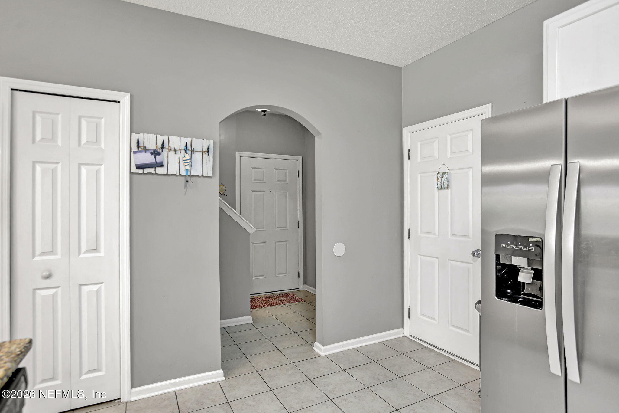 8629 Ribbon Falls Lane Jacksonville, FL 32244 - Photo 7 of 39 a view of a kitchen with refrigerator and wooden floor