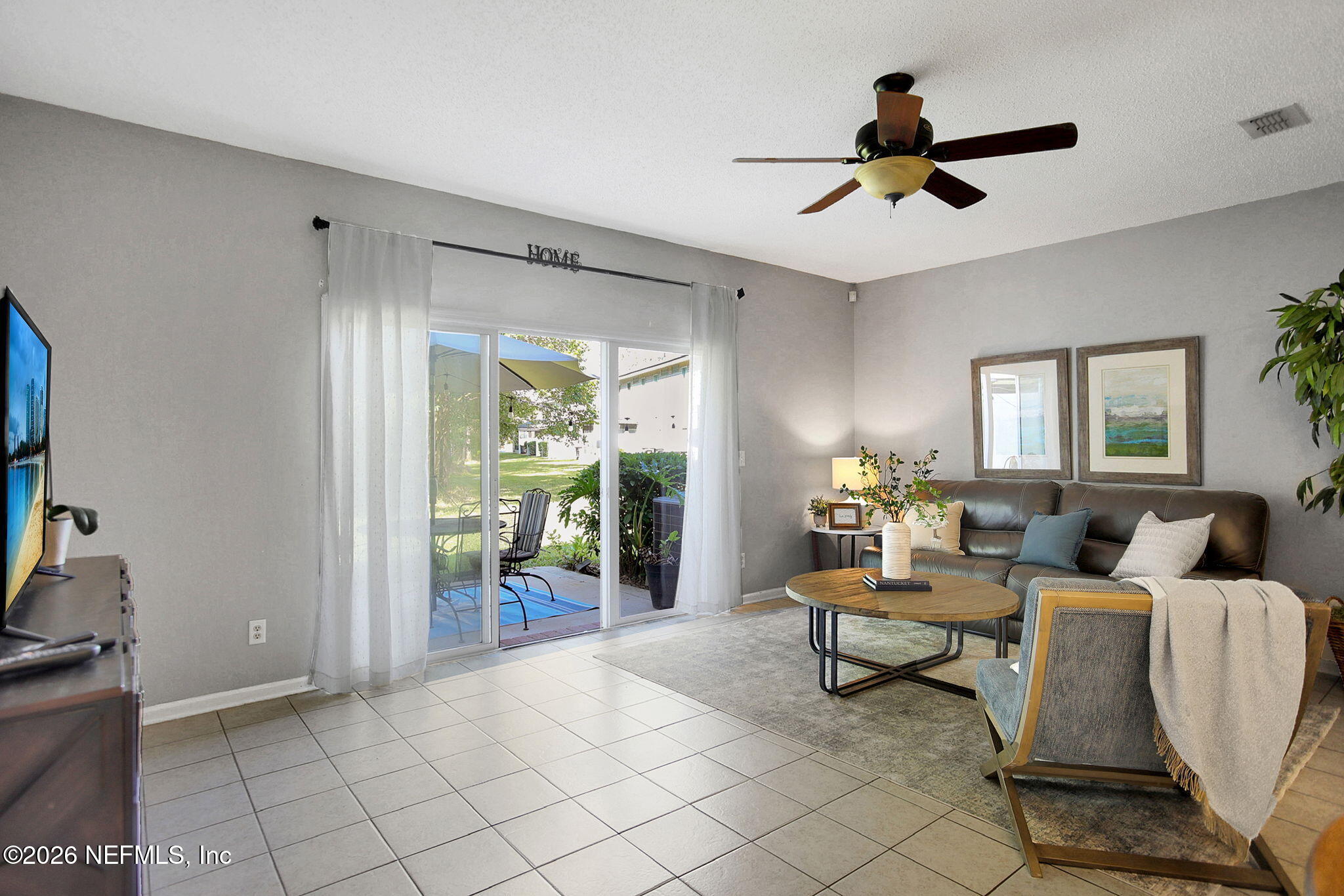 8629 Ribbon Falls Lane Jacksonville, FL 32244 - Photo 8 of 39 a living room with furniture and a window