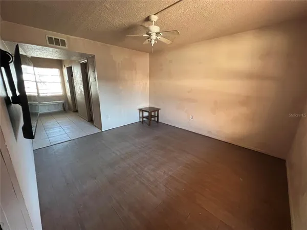 a view of an empty room with a window