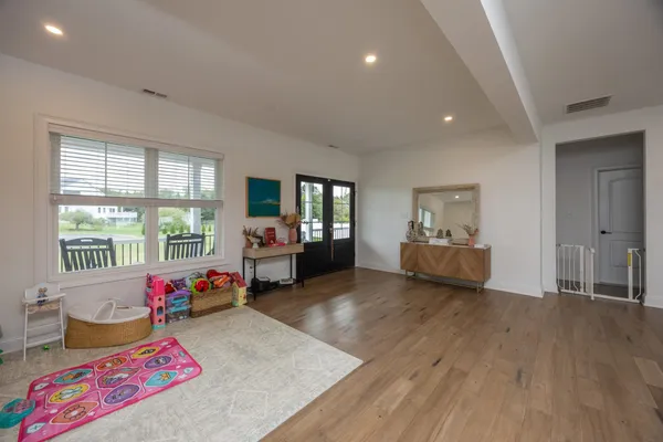 a view of a livingroom with furniture and toys