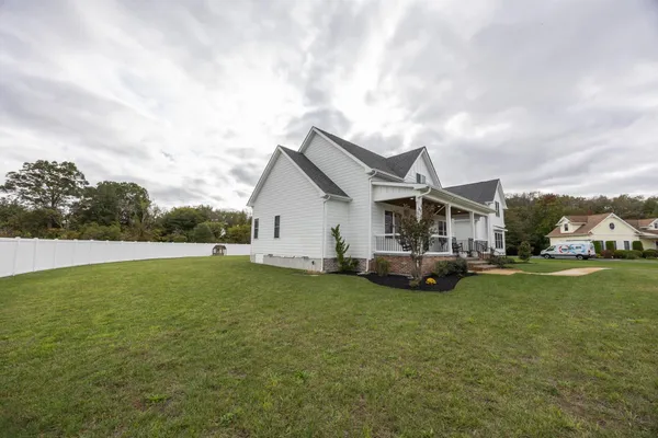 a view of a balcony with chairs