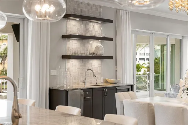 a kitchen with a sink and a refrigerator