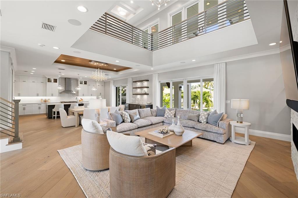 175 Conners Avenue Naples, FL 34108 - Photo 12 of 49 a living room with furniture and a large window