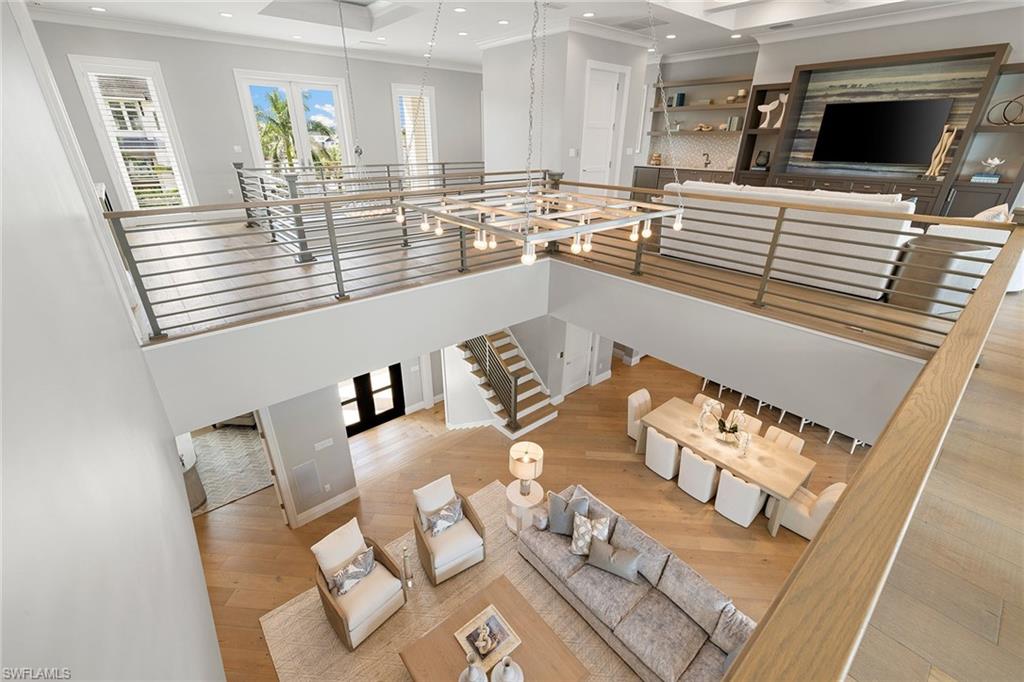 175 Conners Avenue Naples, FL 34108 - Photo 14 of 49 a living room with furniture and a fireplace