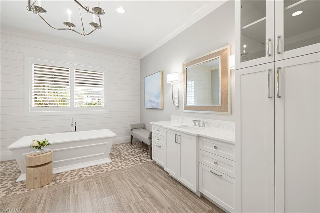 175 Conners Avenue Naples, FL 34108 - Photo 23 of 49 a bathroom with a sink a toilet and a bathtub
