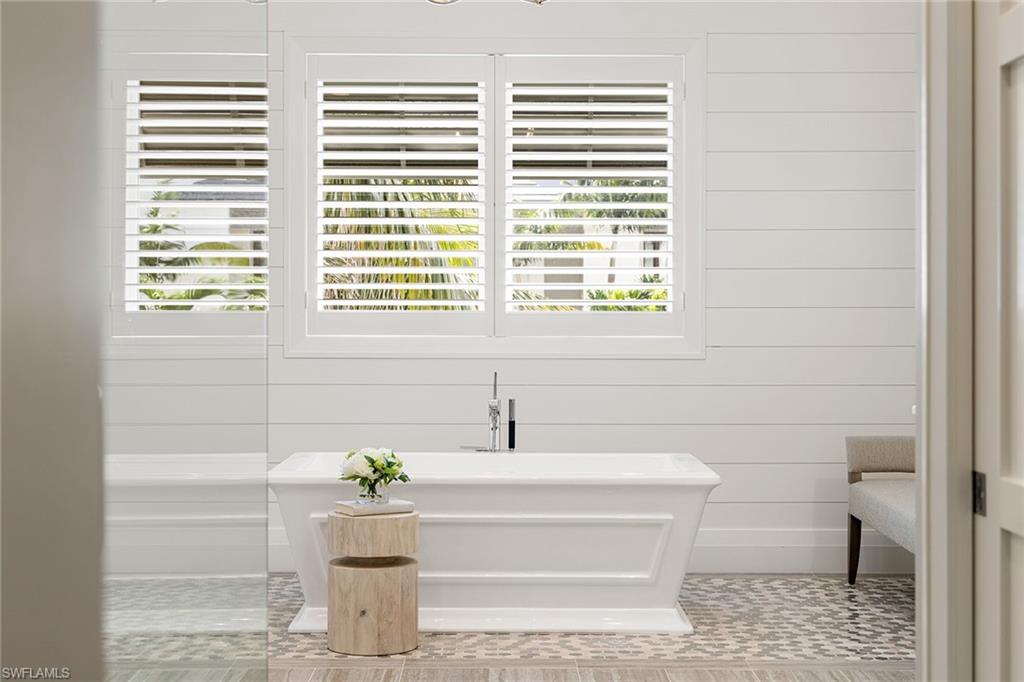 175 Conners Avenue Naples, FL 34108 - Photo 24 of 49 a bathroom with a sink and a bathtub