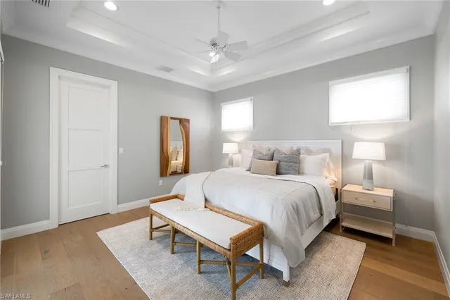 a bedroom with a bed and a table