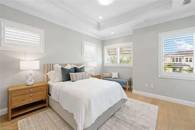 a bedroom with bed and a window