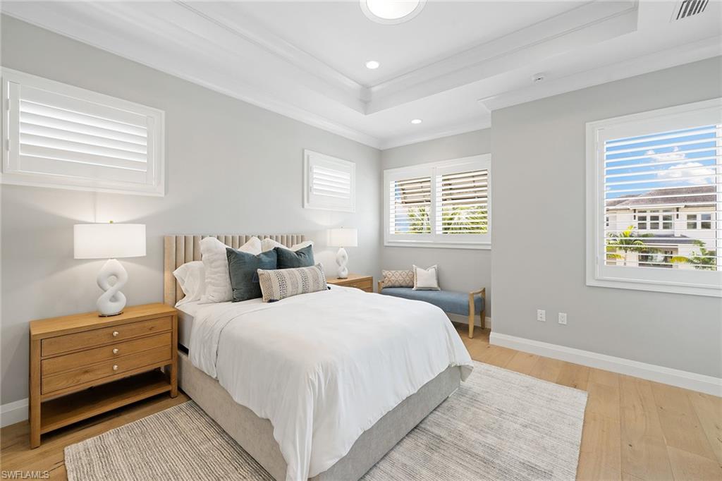 175 Conners Avenue Naples, FL 34108 - Photo 32 of 49 a bedroom with bed and a window