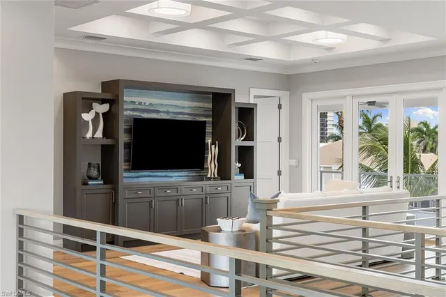 a living room with fireplace furniture and a flat screen tv