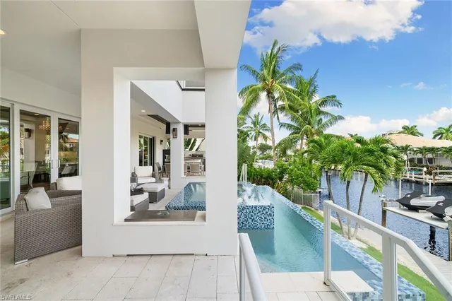 a house with swimming pool and porch