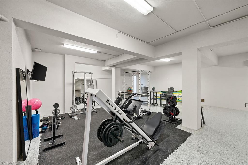 175 Conners Avenue Naples, FL 34108 - Photo 40 of 49 a view of a room with gym equipment