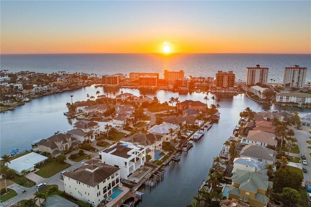 175 Conners Avenue Naples, FL 34108 - Photo 45 of 49 an aerial view of residential houses with outdoor space and river