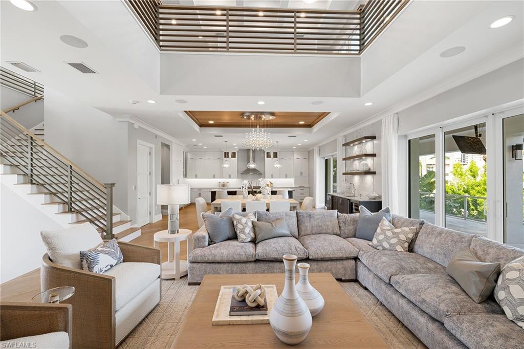 175 Conners Avenue Naples, FL 34108 - Photo 5 of 49 a living room with furniture and a large window