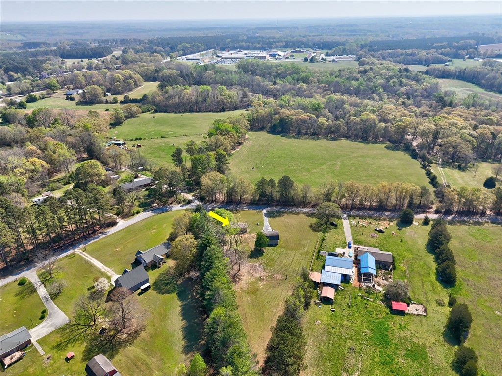 220 Bill Kay Road Belton, SC 29627 - Photo 30 of 30 An expansive rural landscape awaits, offering tranquility and green pastures for diverse opportunities.