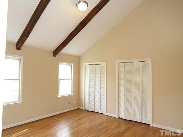 4500 Connell Drive Raleigh, NC 27612 - Photo 16 of 25 a view of an empty room with wooden floor and a window