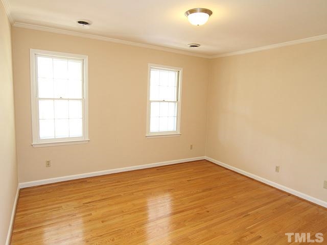 4500 Connell Drive Raleigh, NC 27612 - Photo 20 of 25 an empty room with wooden floor and windows